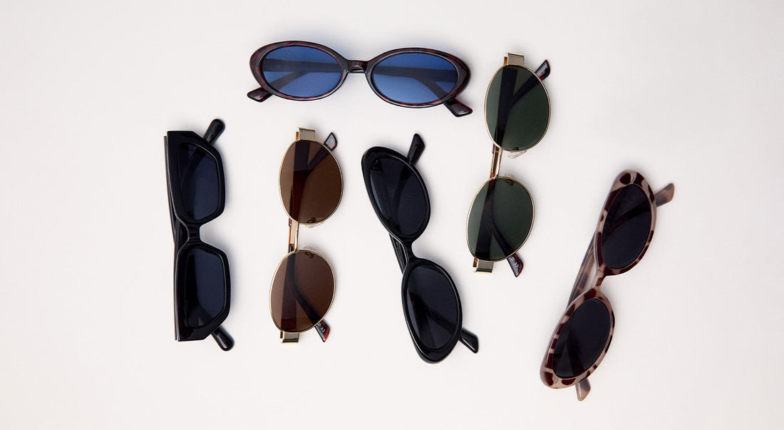 Colección de gafas de sol unisex en diferentes formas y colores sobre fondo blanco